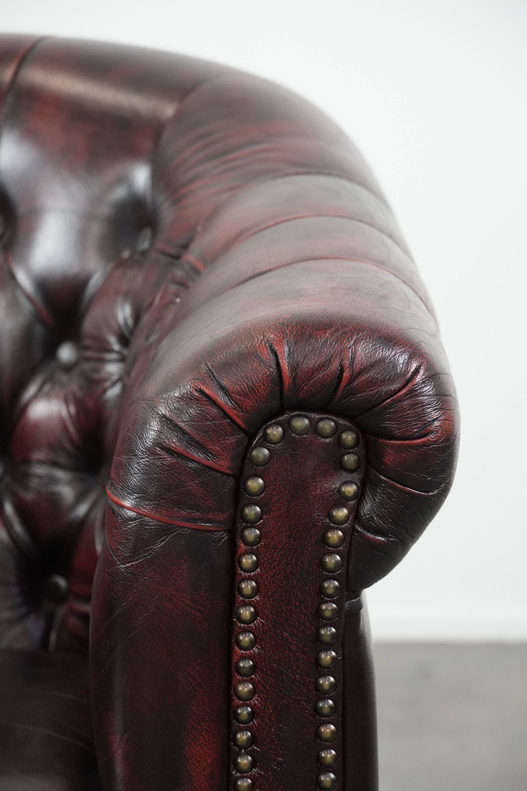 photo for sale Cowhide Chesterfield Club Armchair In Classic English Style, Finished With Decorative Studs