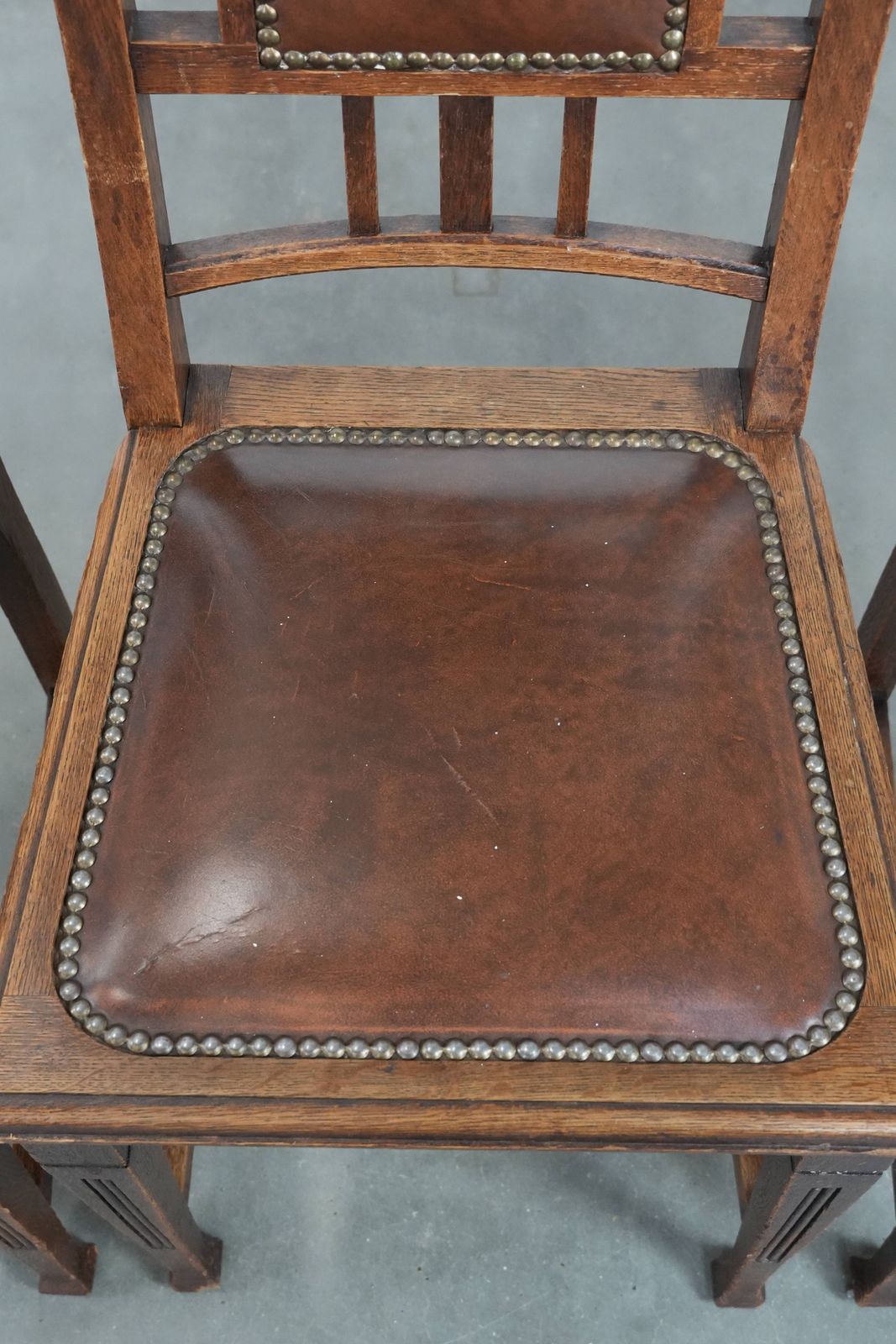 Set Of Four Antique Oak Dining Chairs In Art Nouveau Style With Cognac Colored Cowhide photo vintage
