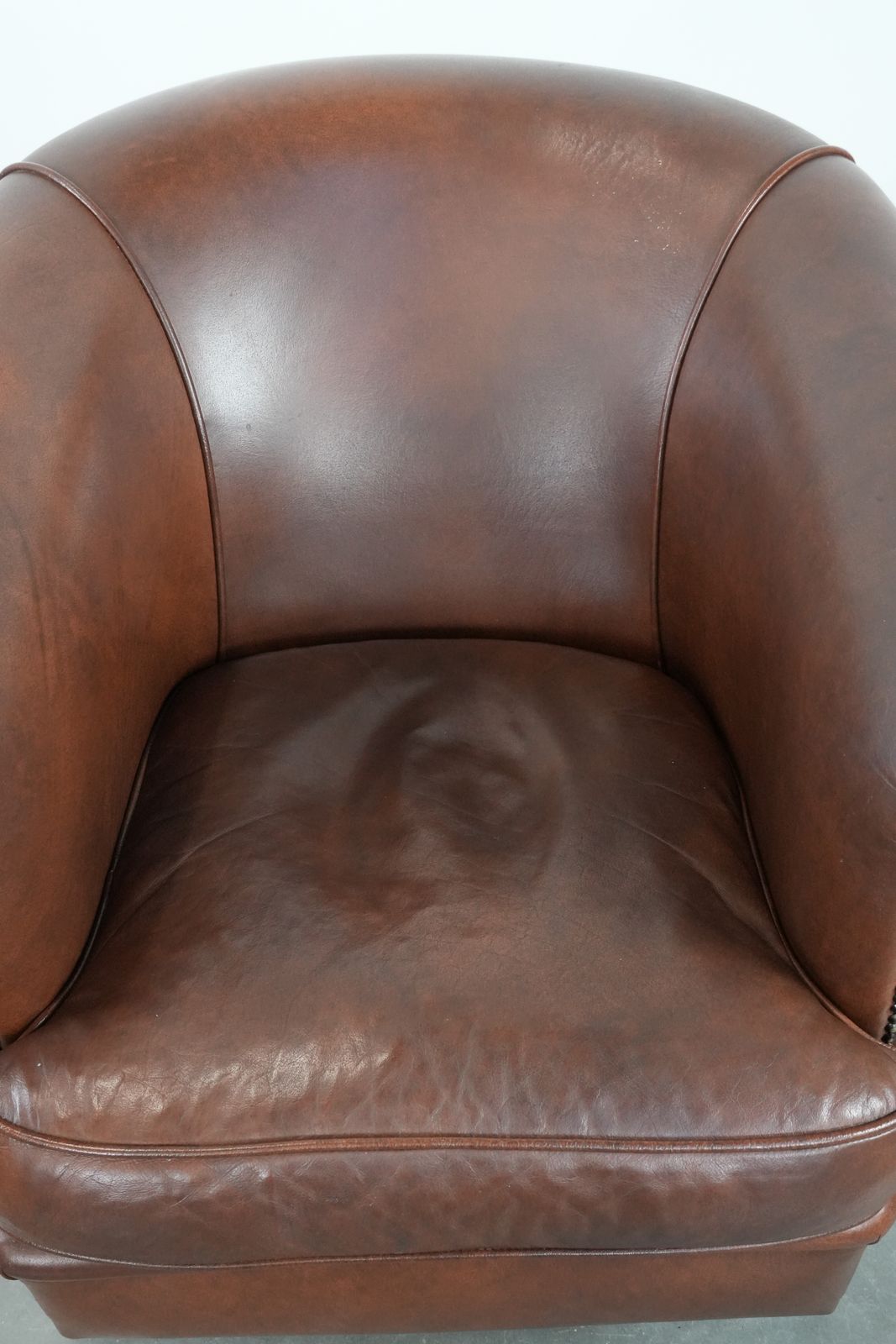 Cognac Colored Cowhide Club Armchair In English Style With A Luxurious Look photo vinterior