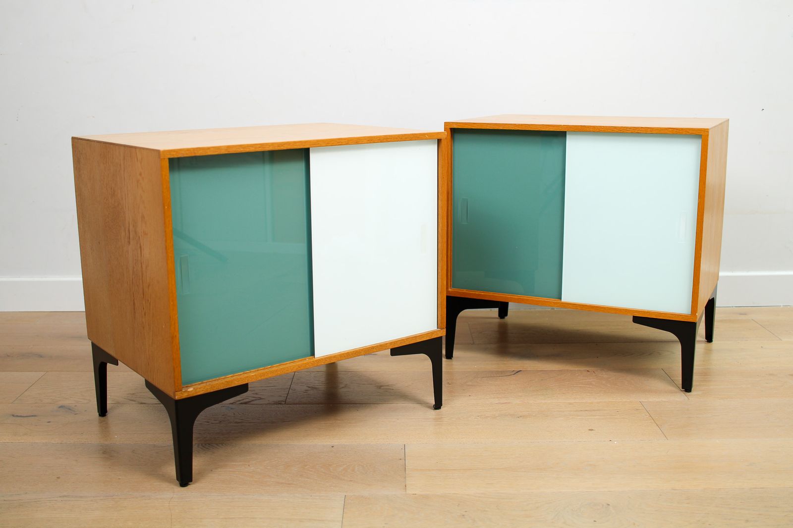 A Pair Of Vintage Mid Century Bedside Tables With Glass Sliding Doors photo Furniture