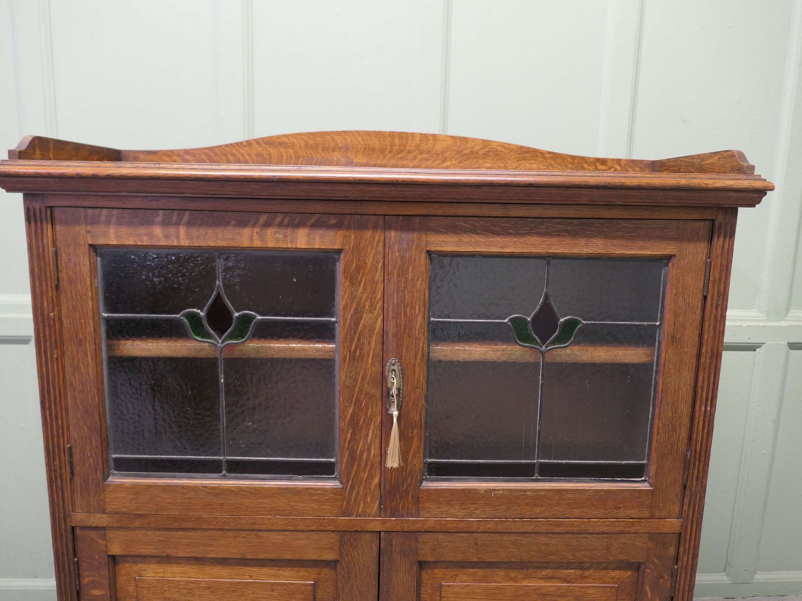 Arts And Crafts Oak Stained Glass Bookcase. photo for sale