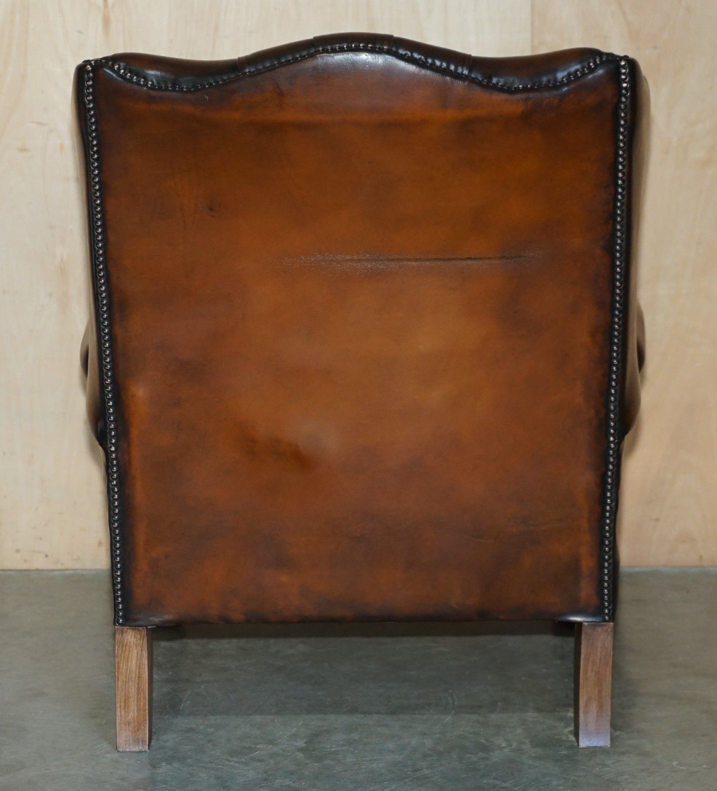 photo vintage Restored Claw & Ball Feet Chesterfield Tufted Brown Leather Wingback Armchair