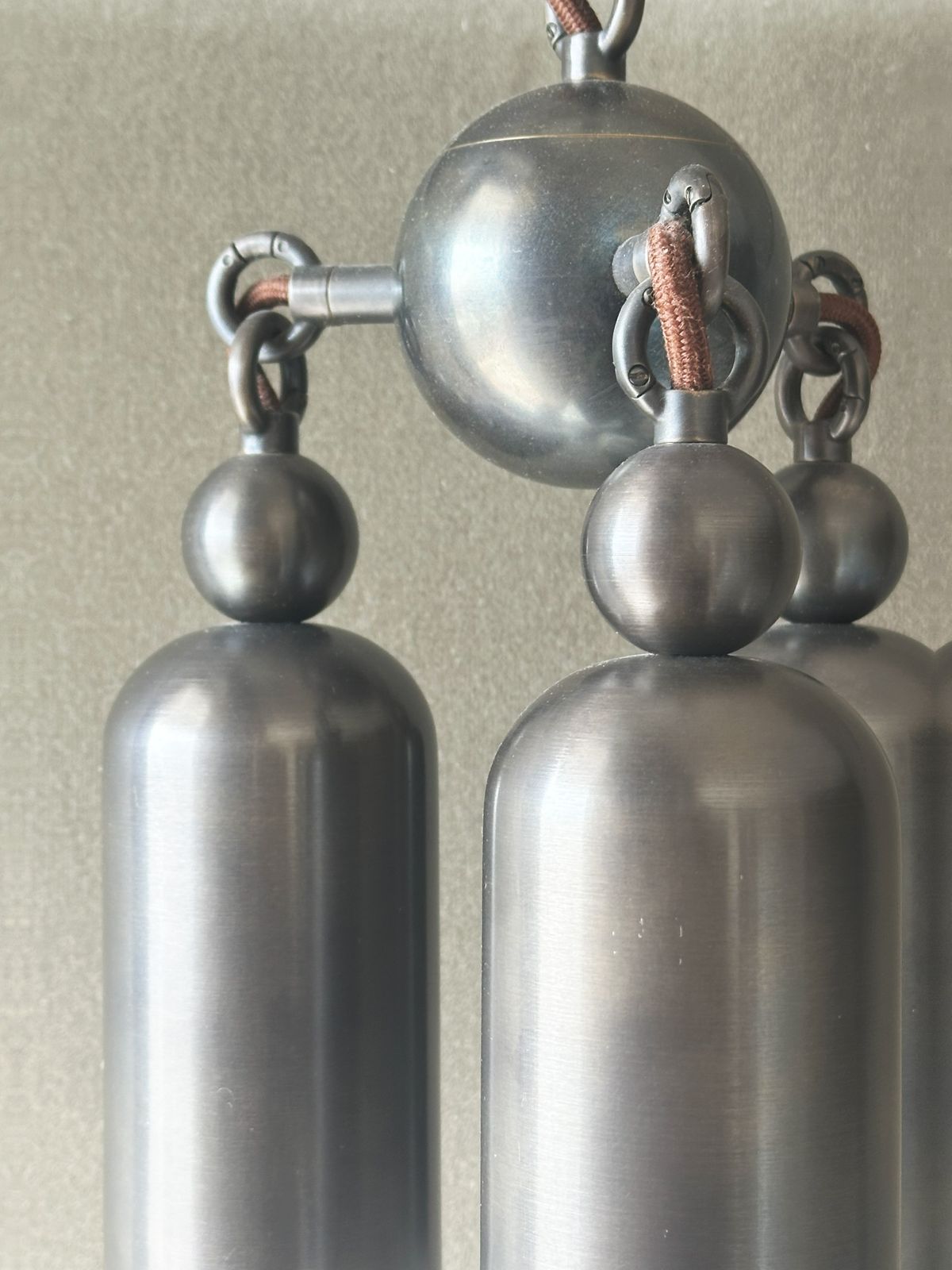 Pair Of Tassel 3 Bronze Pendant Lights By Apparatus Studio photo Lighting