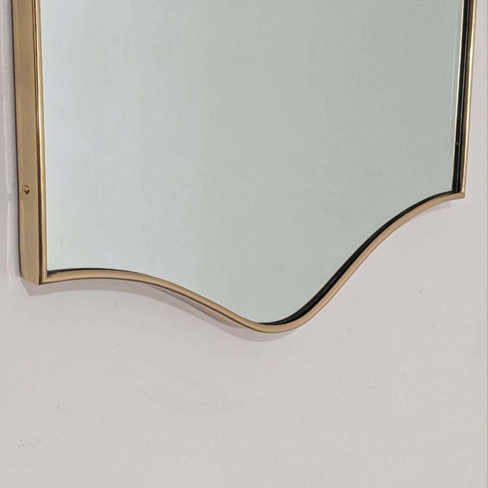 1950s Italian Brass Shield Shaped Mirror In The Style Of Gio Ponti photo vinterior