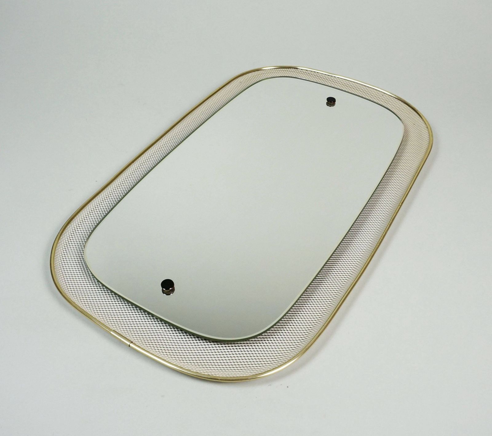 Beautiful 1950s Wall Mirror In Mid Century Modern Style With A Metal Mesh And Brass Frame photo for sale