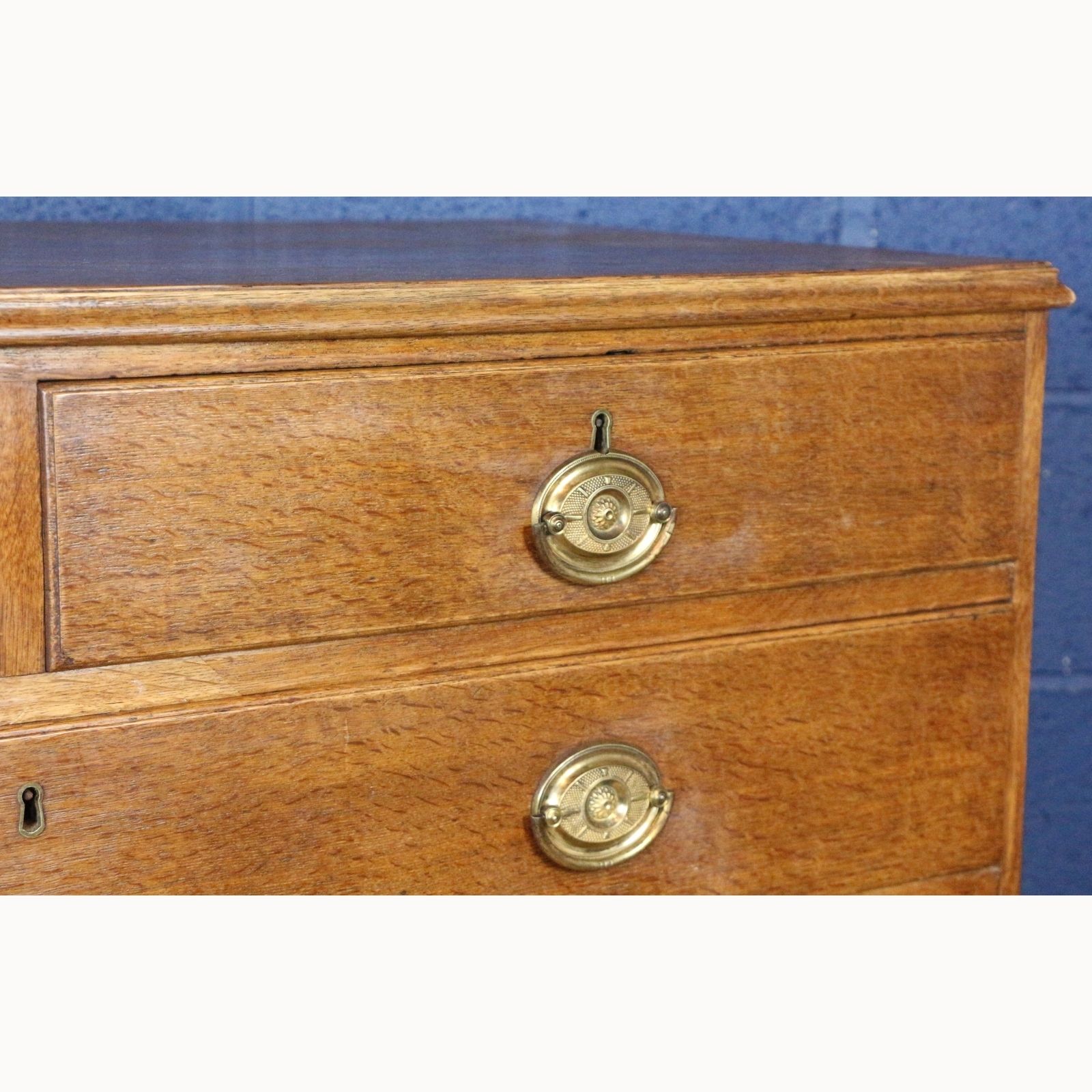 A Georgian Oak Two Over Four Chest Of Drawers Raised On Bracket Feet photo for sale