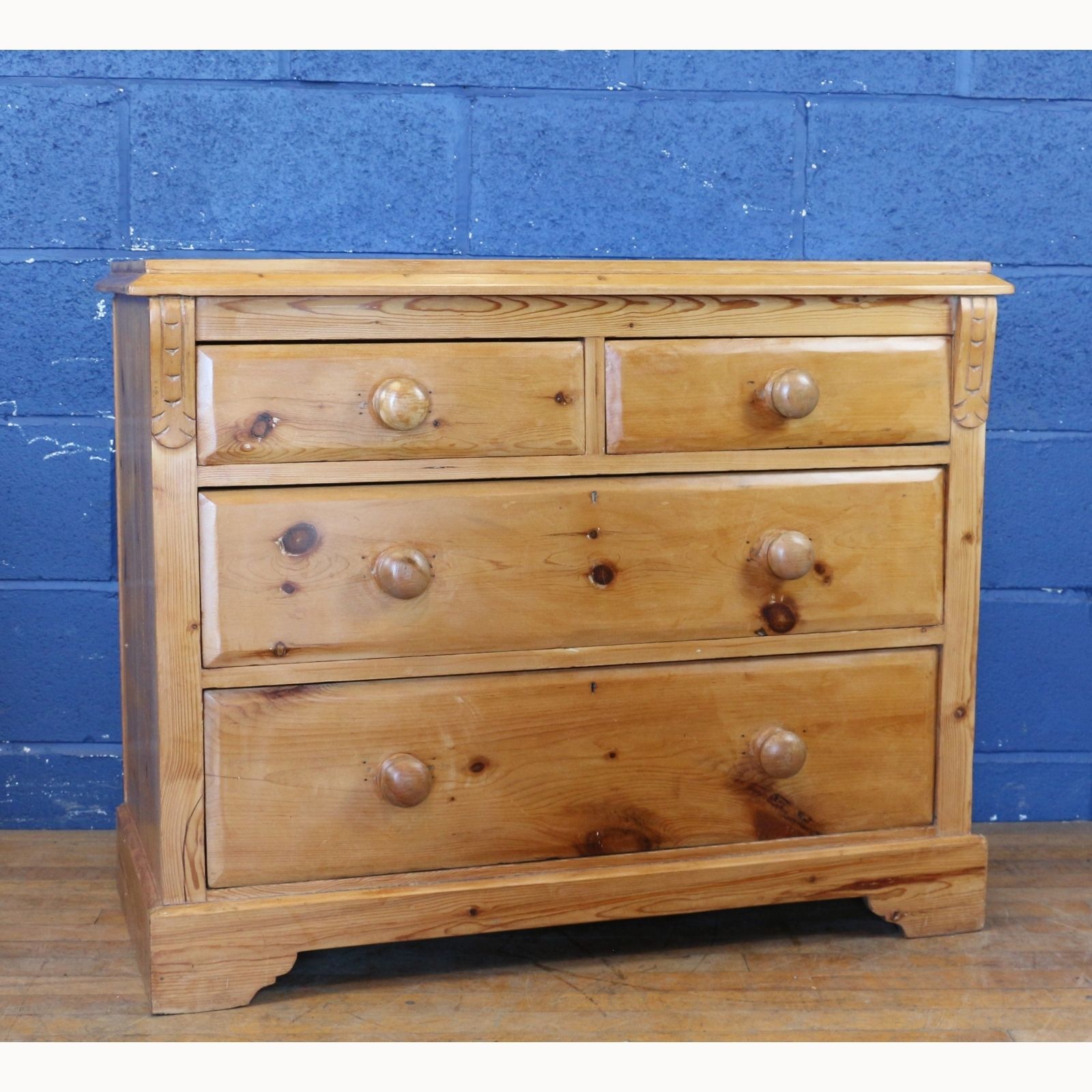 A Victorian Farmhouse Waxed Pine Two Over Two Graduated Chest Of Drawers