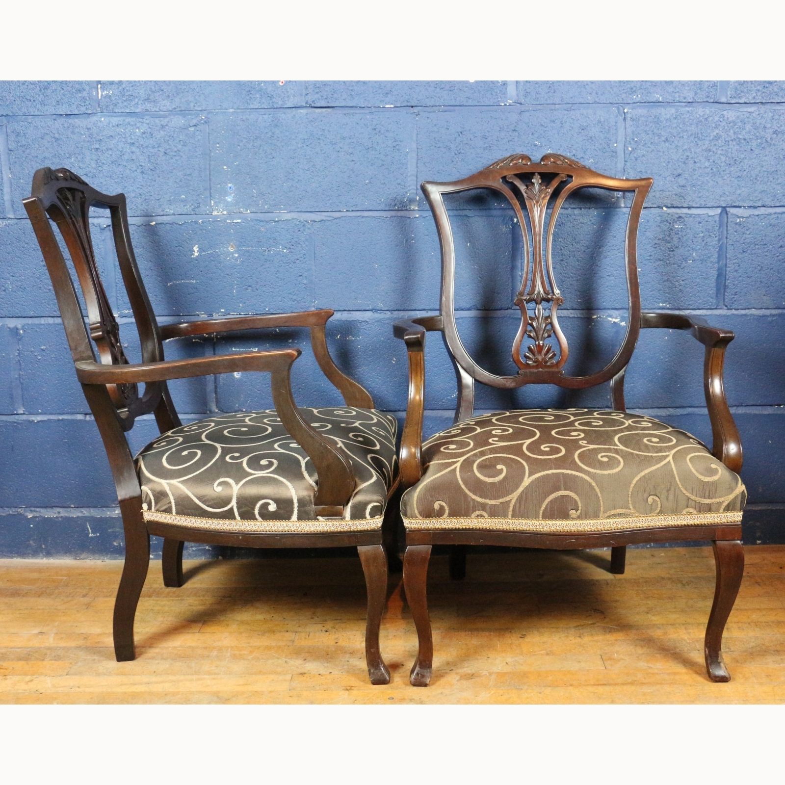 A Pair Of Victorian Carved Mahogany Open Arm Chairs Raised On Cabriole Legs photo furniture