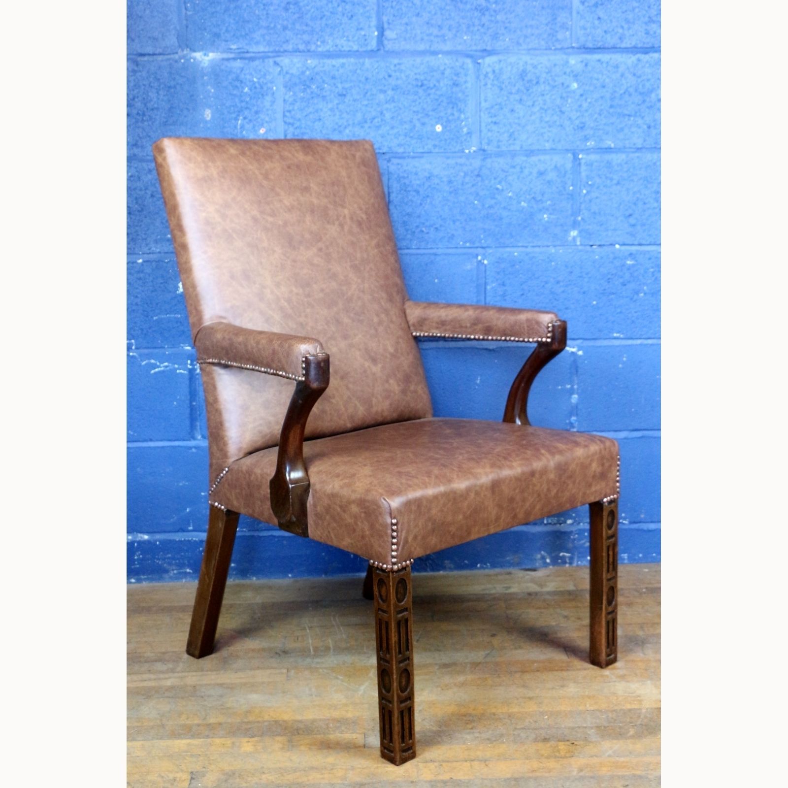 An Antique Mahogany Library Chair Upholstered In Brown Leather