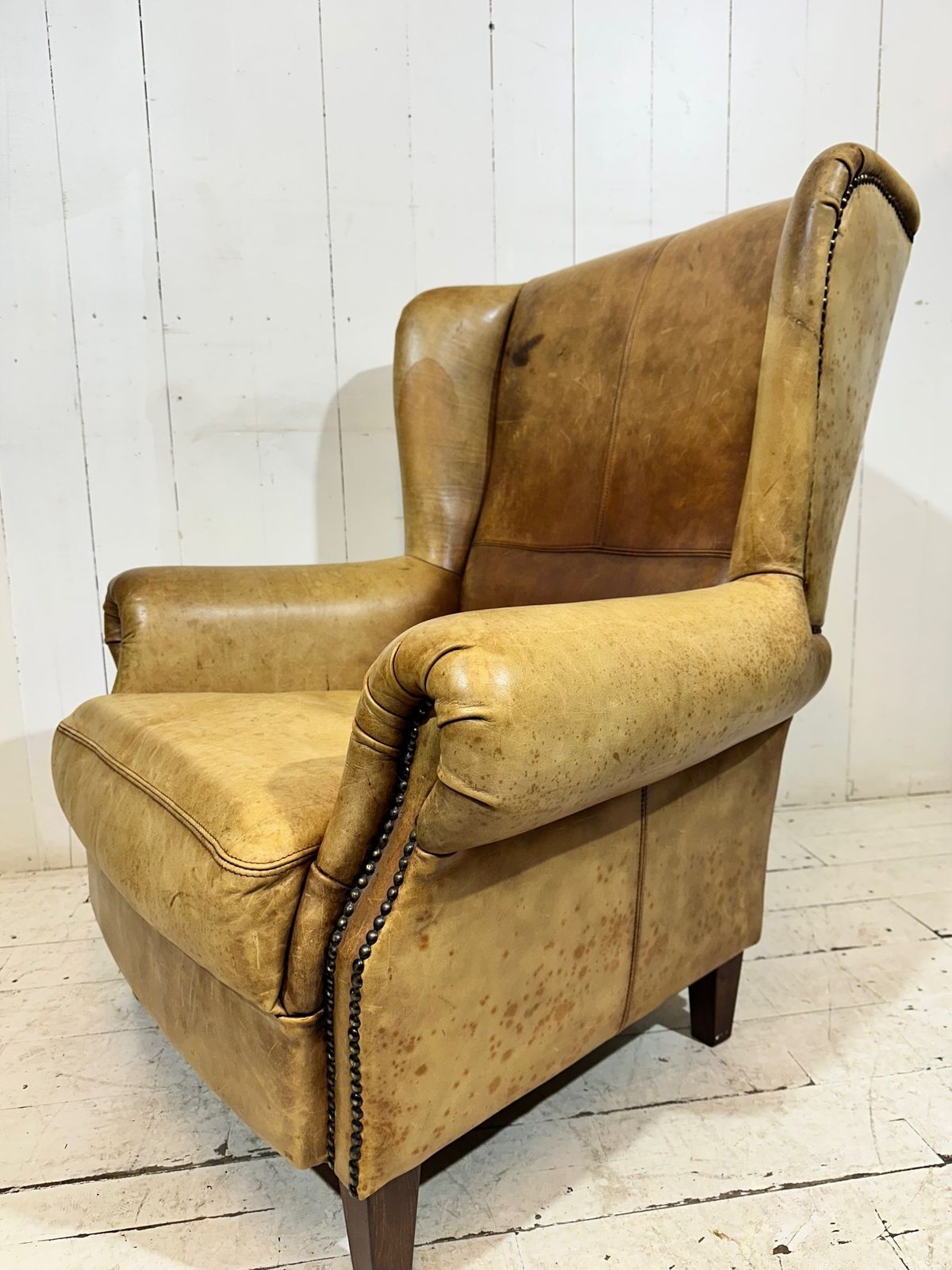 Furniture Vintage Hotel Lounge Wingback Armchair In A Distressed Aniline Leather photo