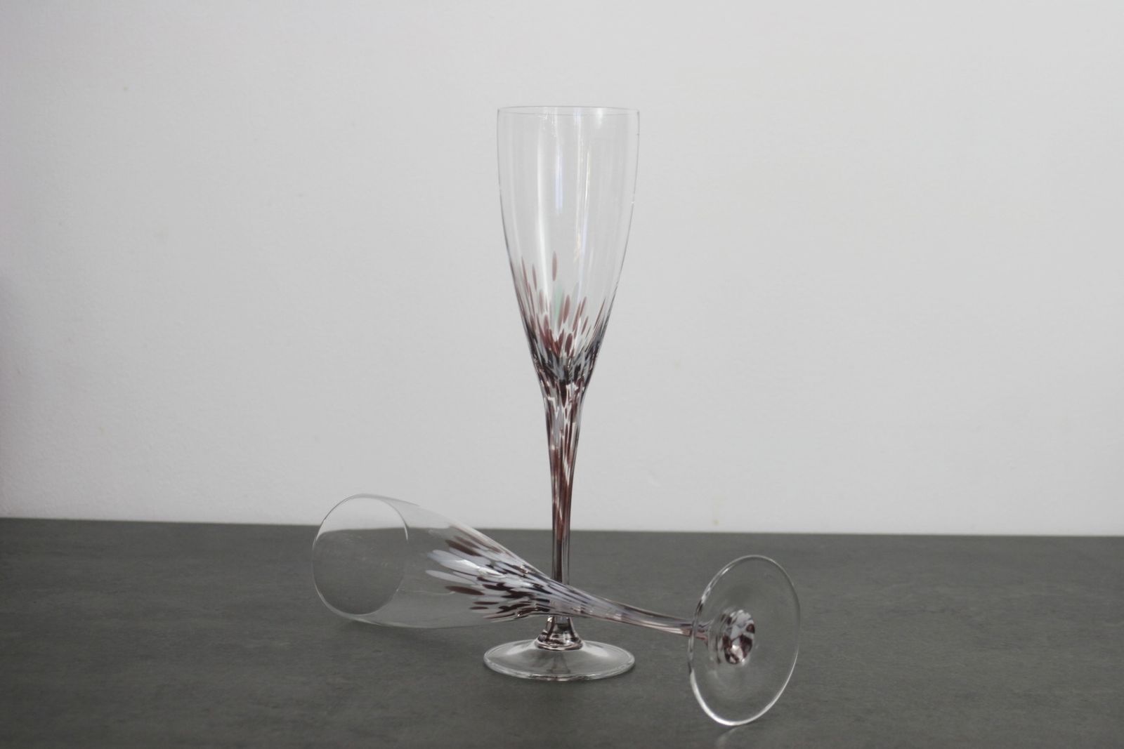 A Set Of Splatter Glass Champagne Flutes photo furniture