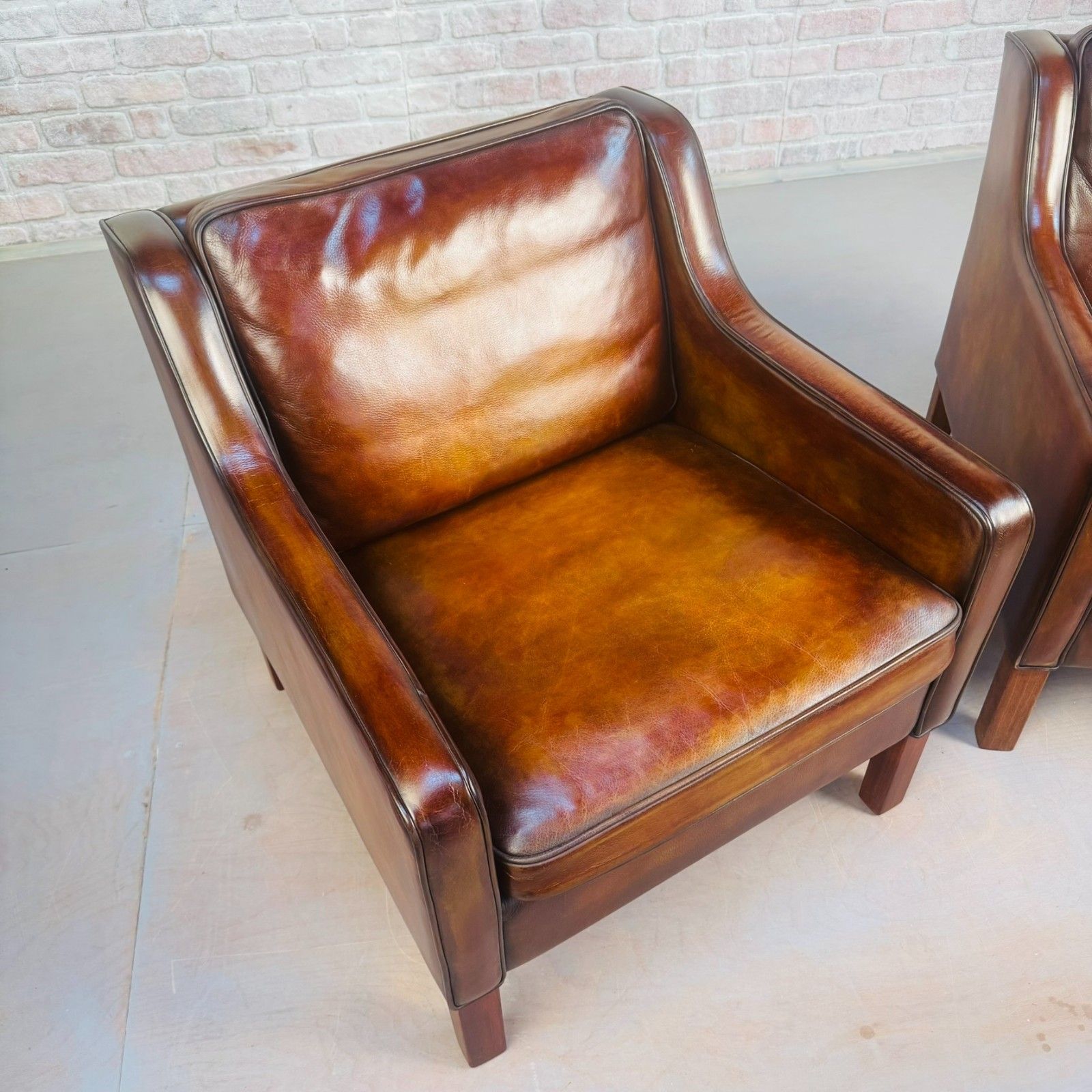photo for sale Pair Of Tan Leather Børge Mogensen Style Danish Armchairs – Hand Dyed Patina