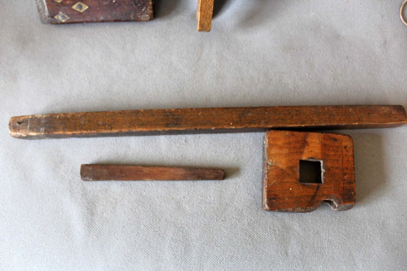 photo furniture Set Of Four Antique Wood Tools, Surveyor Coiled Steel Tape Measure With Brass, A Scribe Marking Gauge, Square With Inlay, Metal Plumb Bob,