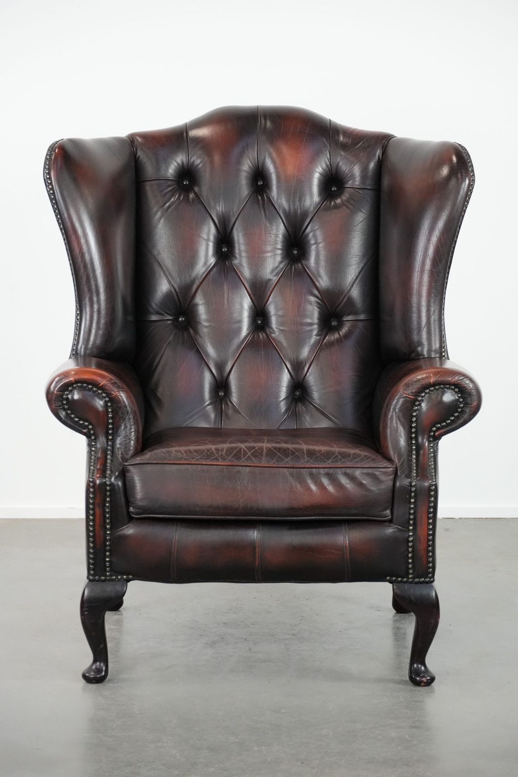 Beautiful, Luxurious, And Comfortable Brown Cowhide Chesterfield Wing Armchair In A Classic English Style. photo furniture
