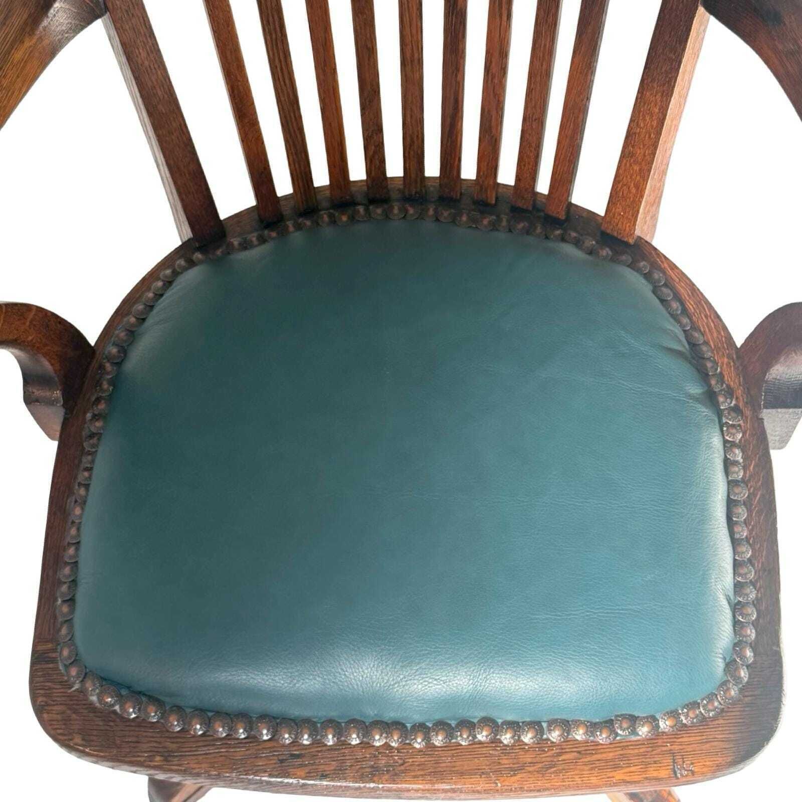 755.0 Bent Wood Captains Chair   Mounted On A Swiveling Base   Green Seat, Cast Iron Base photo