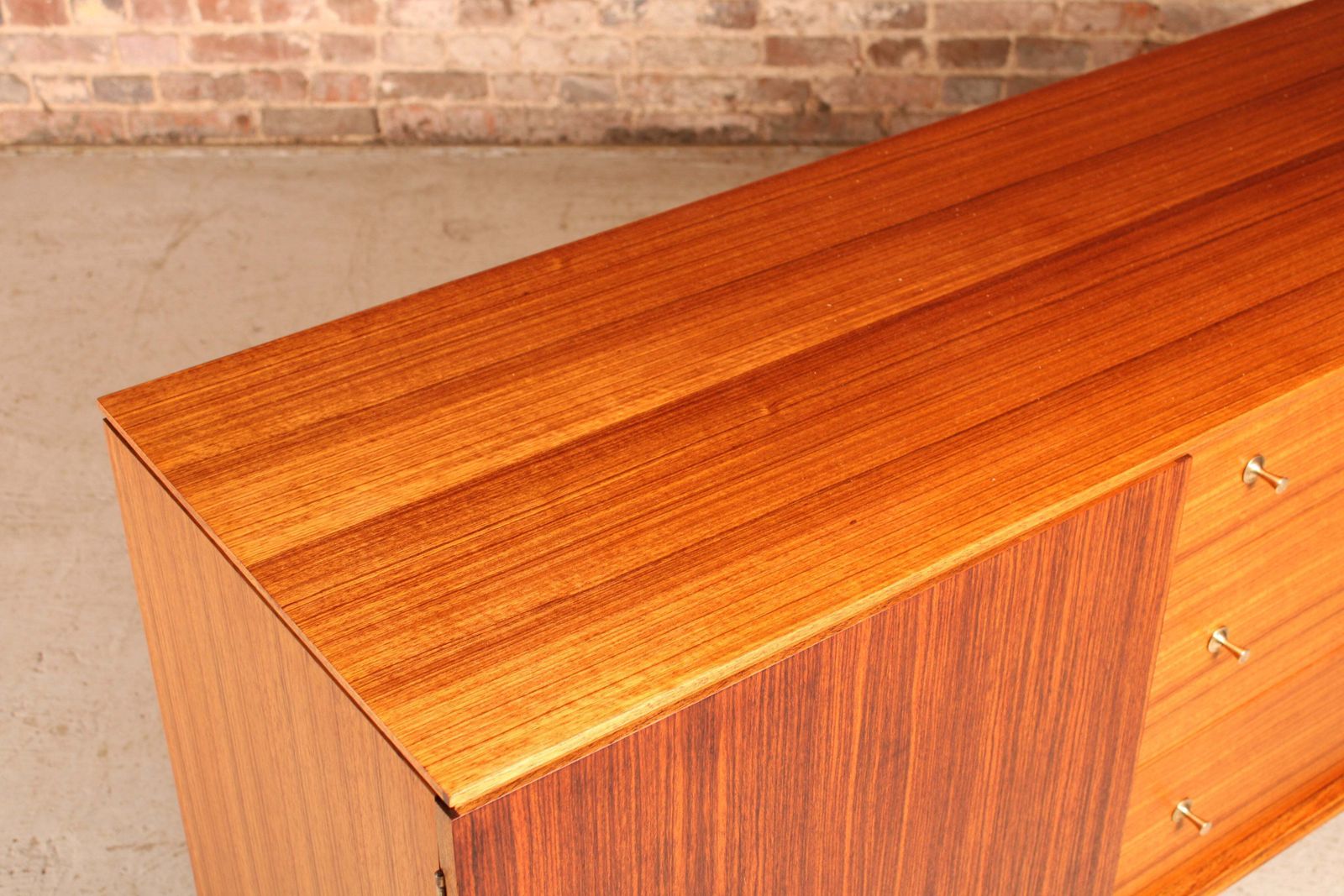 Furniture Mid Century Teak And Rosewood Sideboard With Brass Handles By Wrighton, Circa 1960s photo