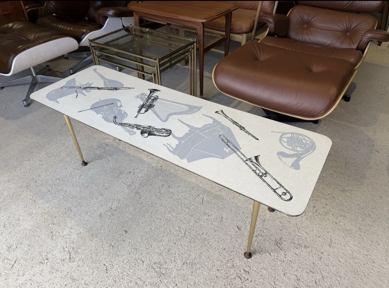 Retro Mid Century Coffee Table With Various Music Instruments On Top 1960s photo vinterior