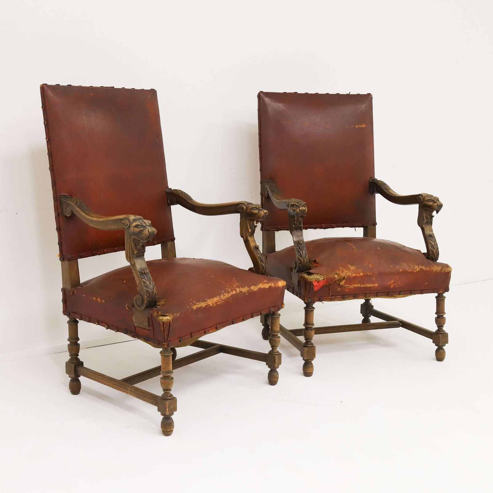 Pair Of French Louis XIV Style Mahogany Lion Head Fauteuils With Distressed Leather photo for sale