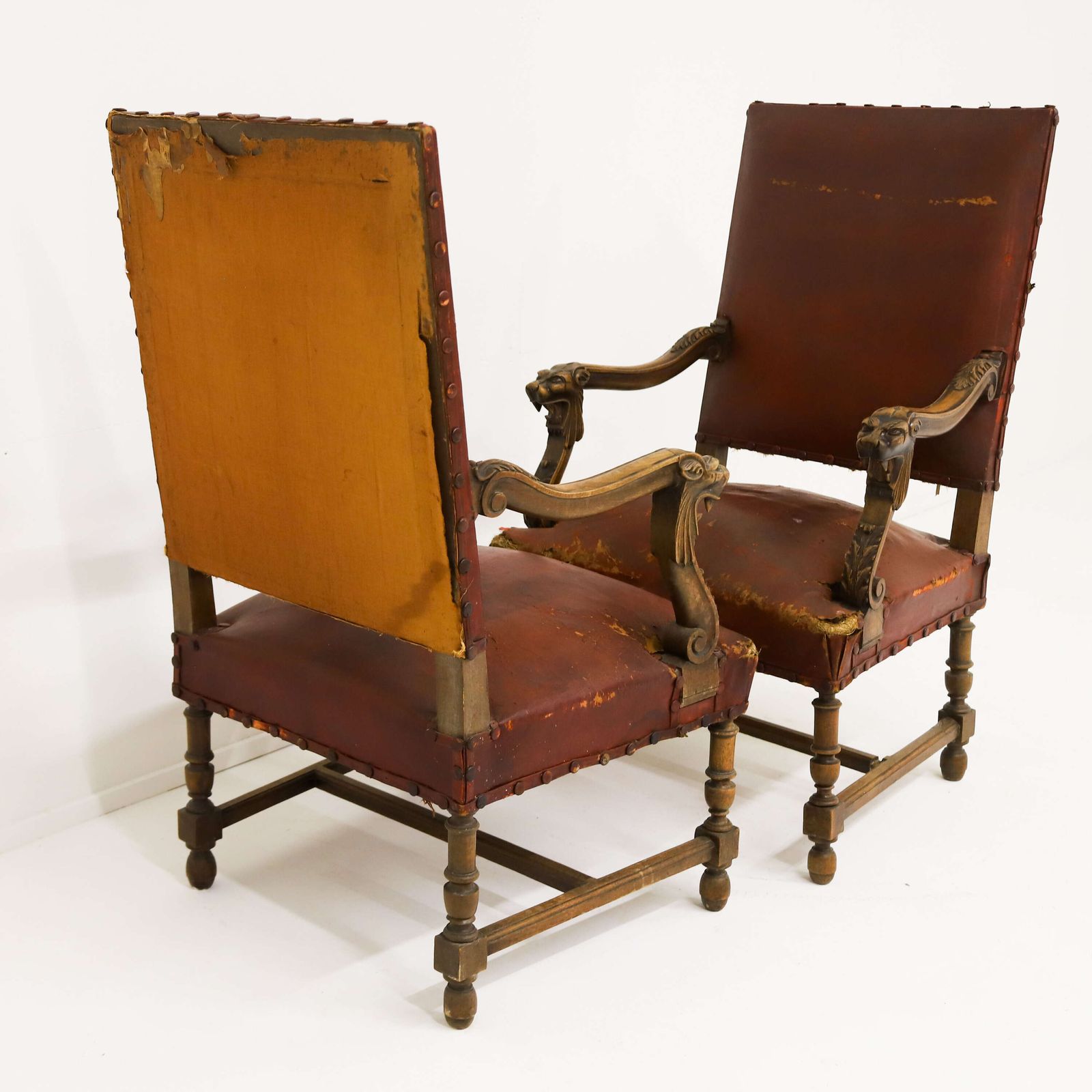 photo buy Pair Of French Louis XIV Style Mahogany Lion Head Fauteuils With Distressed Leather