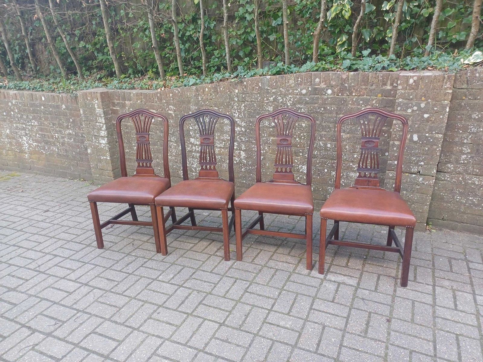 Set Of Four Vintage 1920s Mahogany Dining Chairs With Carved Backs And Brown Vinyl Seats