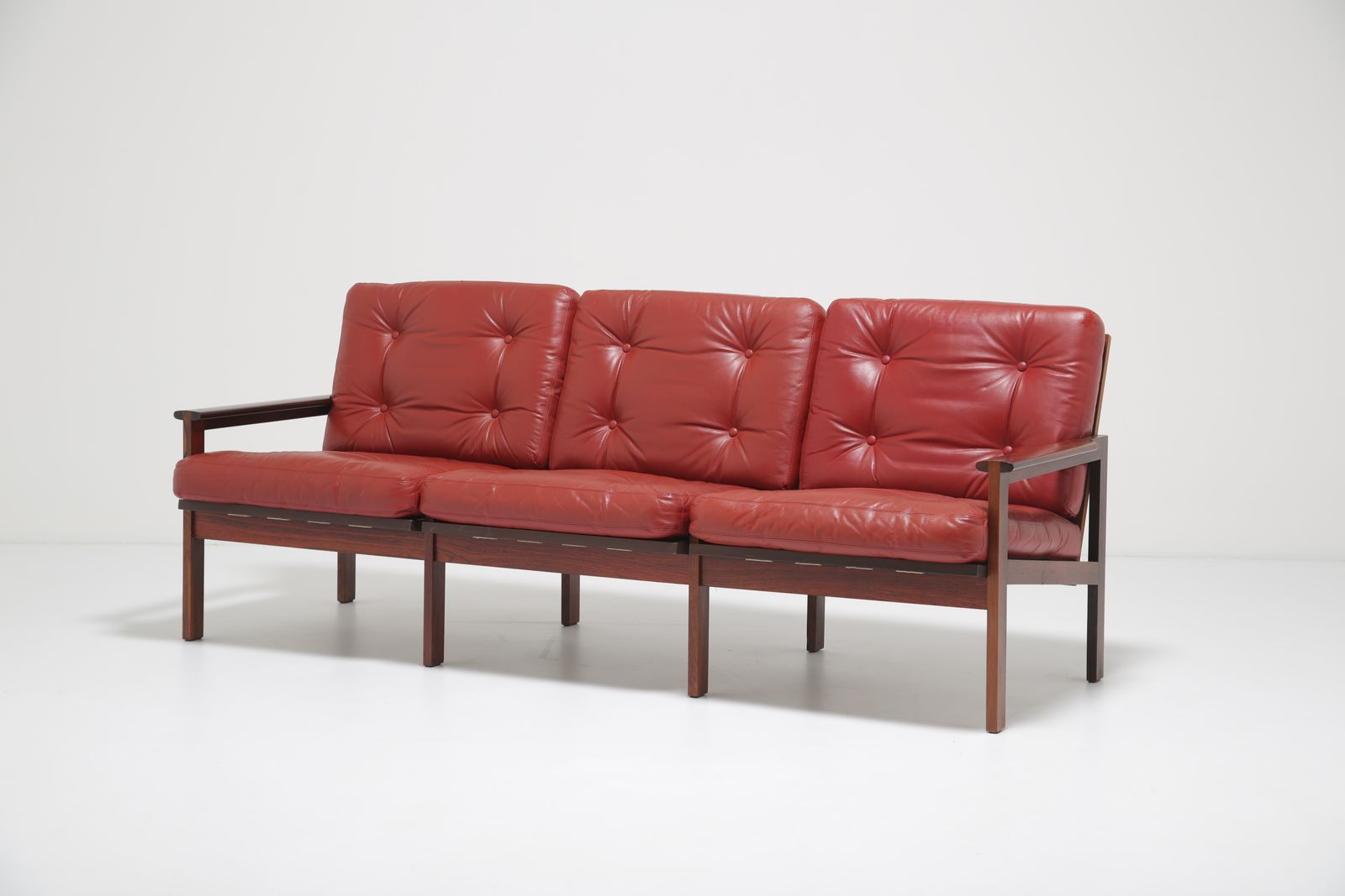 Illum Wikkelsø Figured Rosewood Sofa: Model ‘Capella’ Three Seater In Figured Rosewood & Red Leather For Niels Eilersen, Denmark, 1960s
