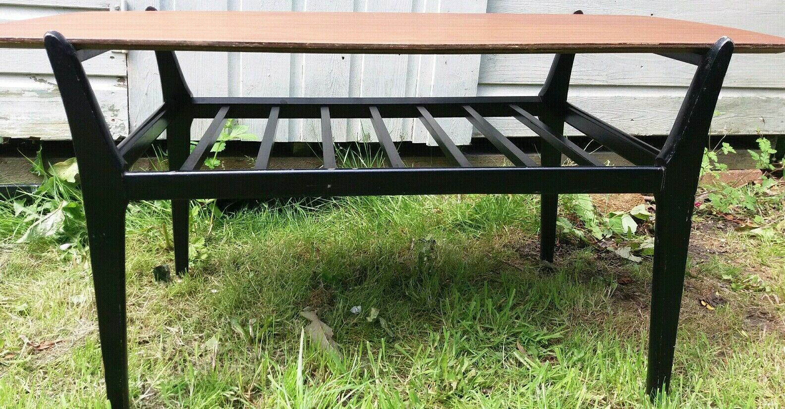 Mcm Nathan Ebonised Leg Tola Coffee Table With Magazine Rack photo for sale