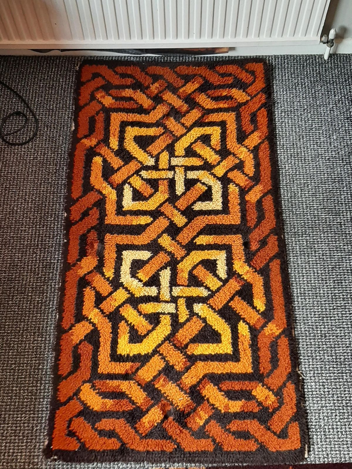Mid Century Shag Pile Latch Hook Rug Small Celtic Pattern In Reds, Oranges And Yellows