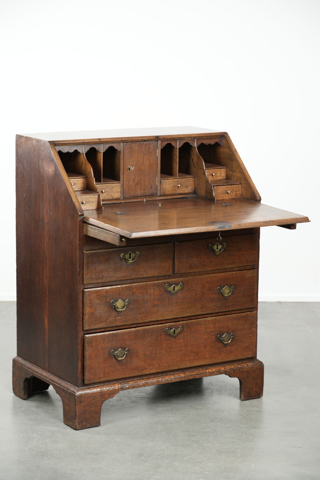 Subtle Antique English Oak Secretary Desk From The 18th Century With A Beautiful Stepped Interior. photo furniture