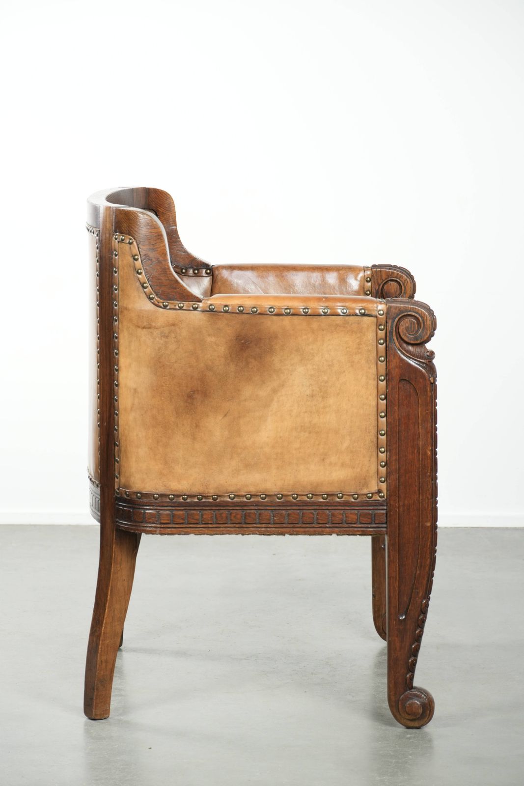Antique Armchair Of Sheepskin And Wood With Decorative Nails And Beautiful Woodwork photo for sale