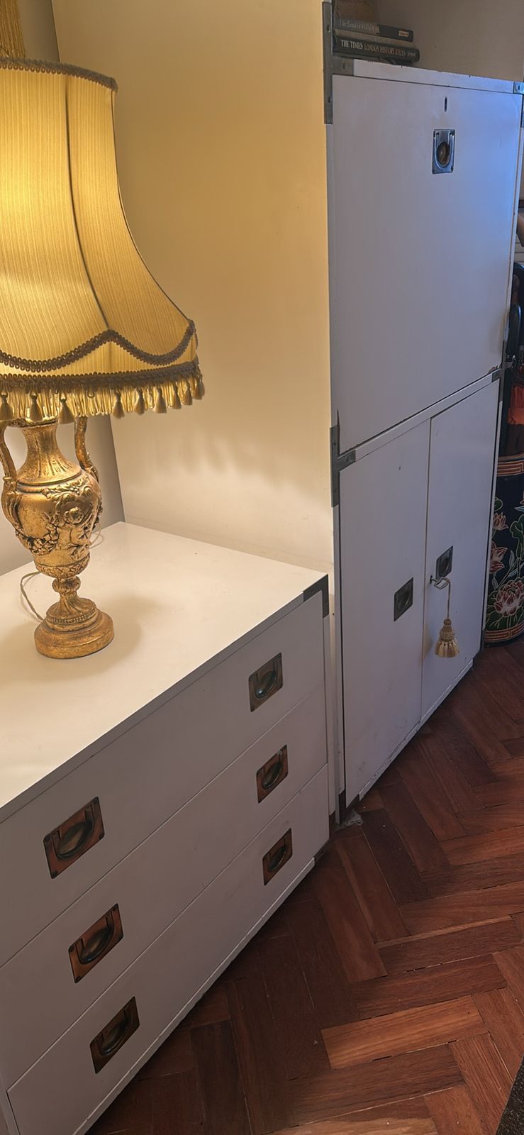 A Mid Century Modular White Shelving Unit In A Campaign Style With Solid Brass Features photo furniture