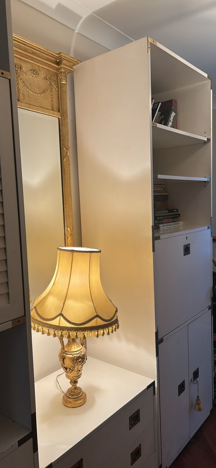 A Mid Century Modular White Shelving Unit In A Campaign Style With Solid Brass Features photo 160.0