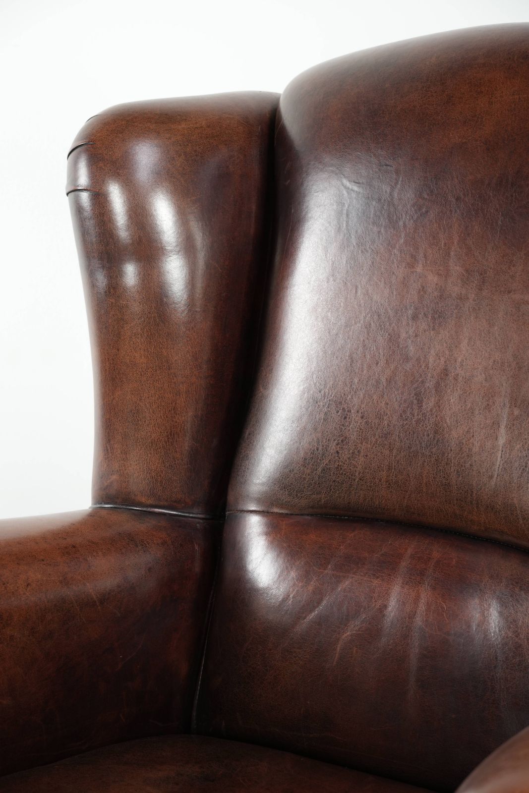 1265.0 Beautiful Large And Comfortable Sheepskin Wing Armchair With Lovely Deep And Warm Colors And A Finish With Decorative Nails. photo