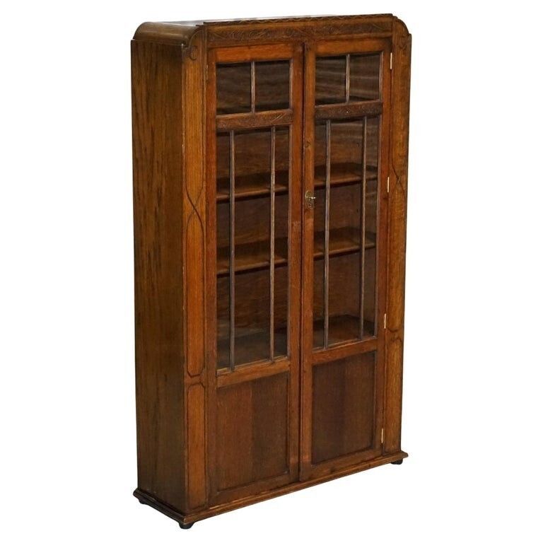 Antique Circa 1920's English Oak Art Deco Carved Bookcase Cabinet