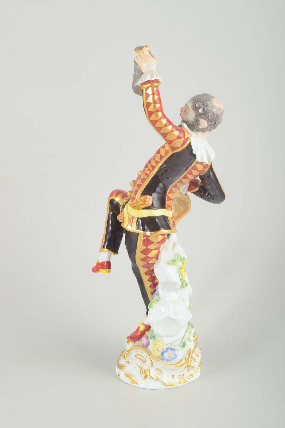 Meissen. Porcelain Figure Of “Harlequin” In A Classic Commedia Dell’arte Costume photo vinterior