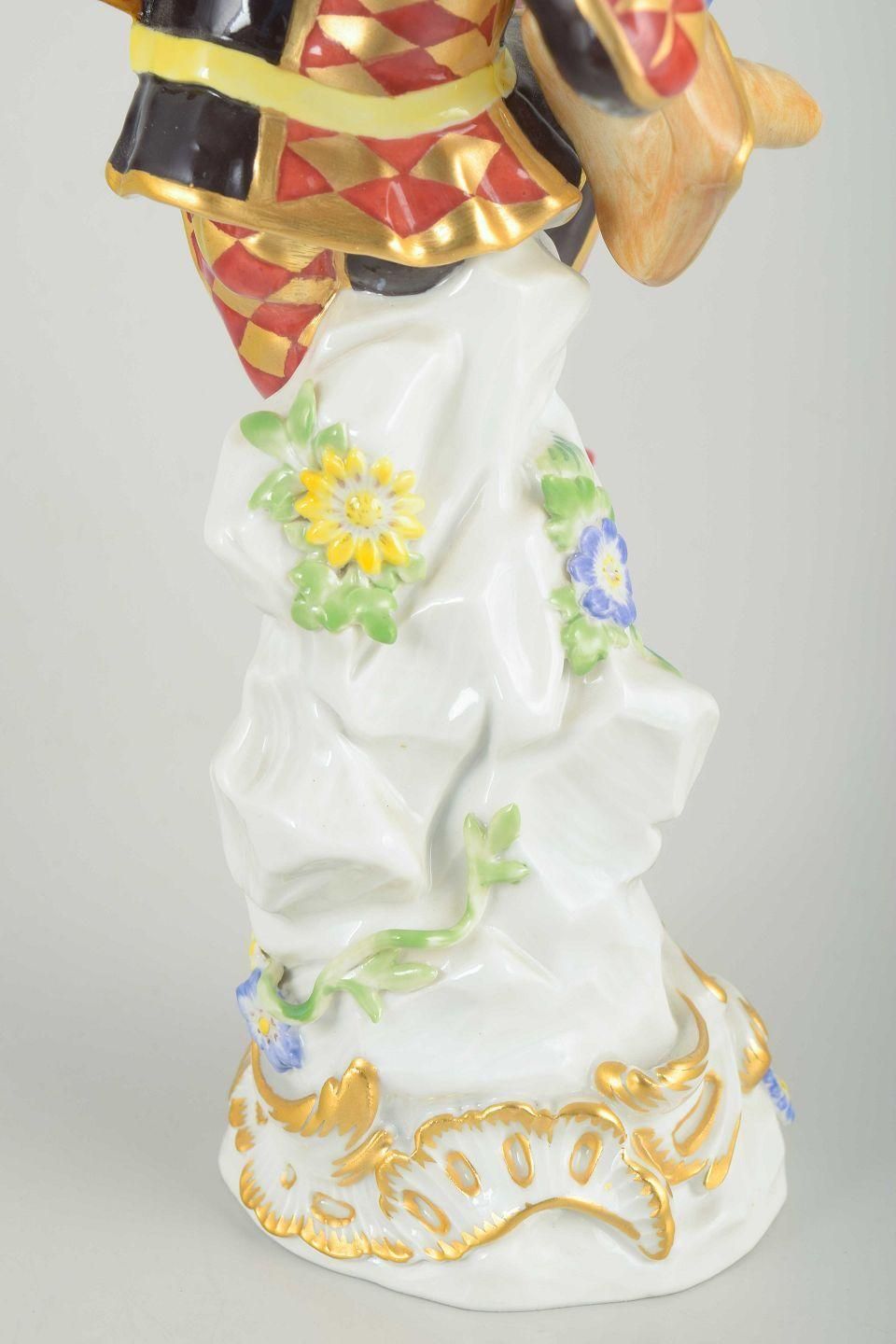 Meissen. Porcelain Figure Of “Harlequin” In A Classic Commedia Dell’arte Costume photo vintage