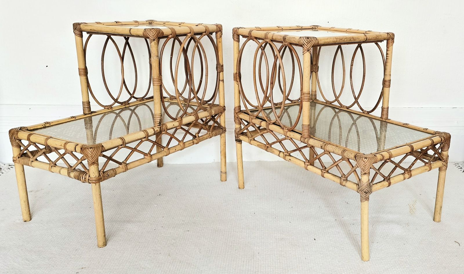 A Pair Of Mid Century French Bamboo & Glass Tiered Bedside Tables.