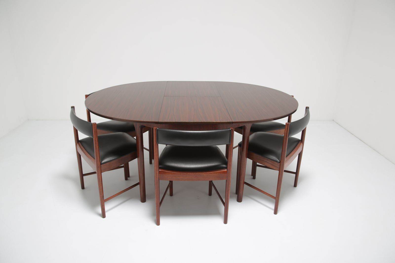 photo buy Tom Robertson Circular To Oval Dining Table & Chairs ‘Dunvegan’ In Brazilian Rosewood For McIntosh, 1960s