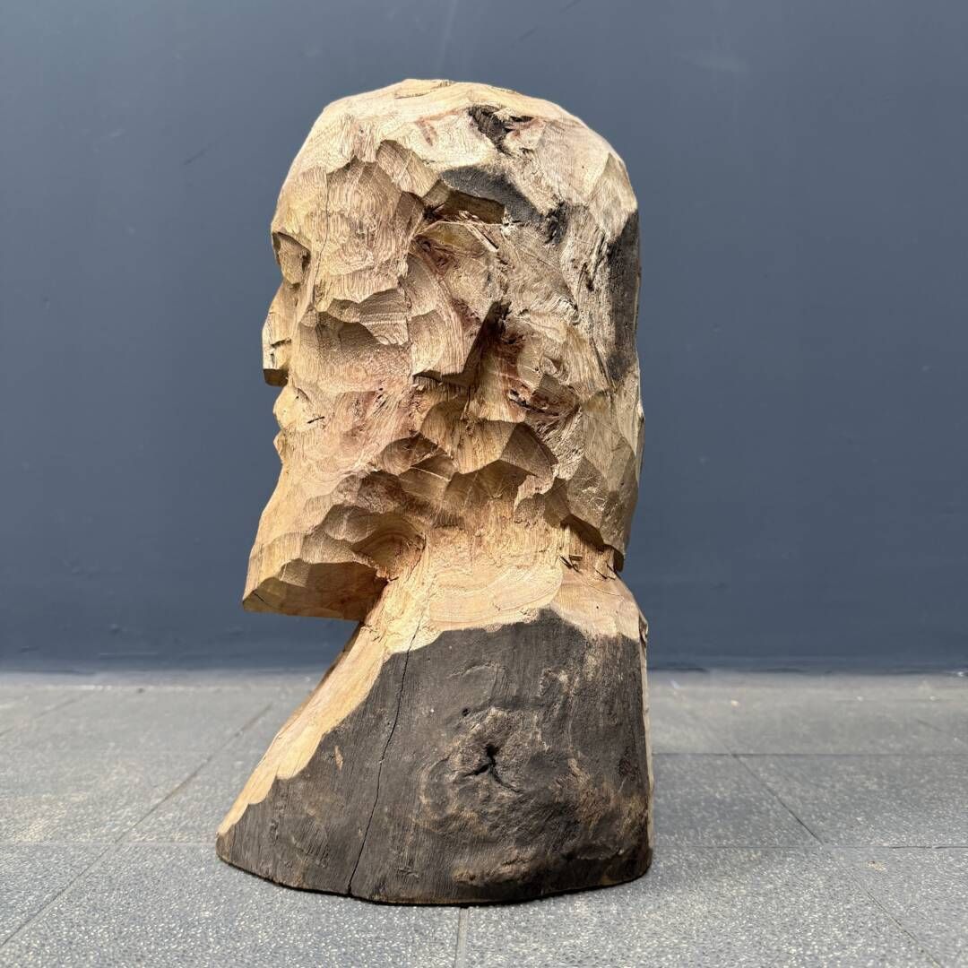 Art A Wooden Carving Of A Man's Head Or Bust With A Beard photo