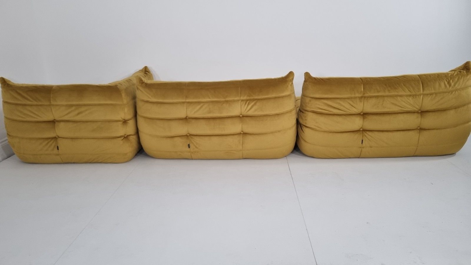 6900.0 Ligne Roset Togo 2 X 2 Seater And Corner In Bronze Gold Velvet photo