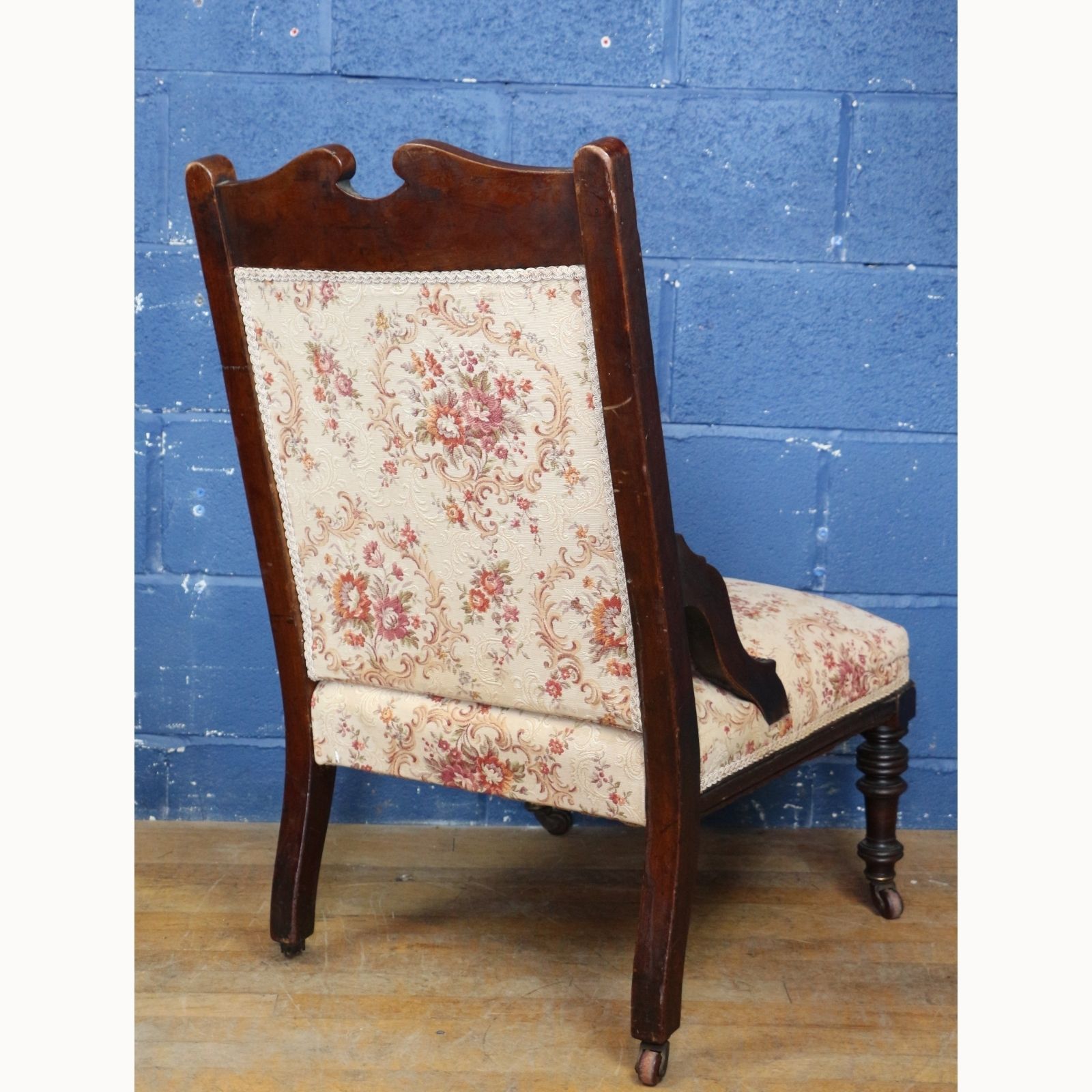 A Victorian Carved Walnut Framed Fireside Chair Raised On Turned Supports photo buy