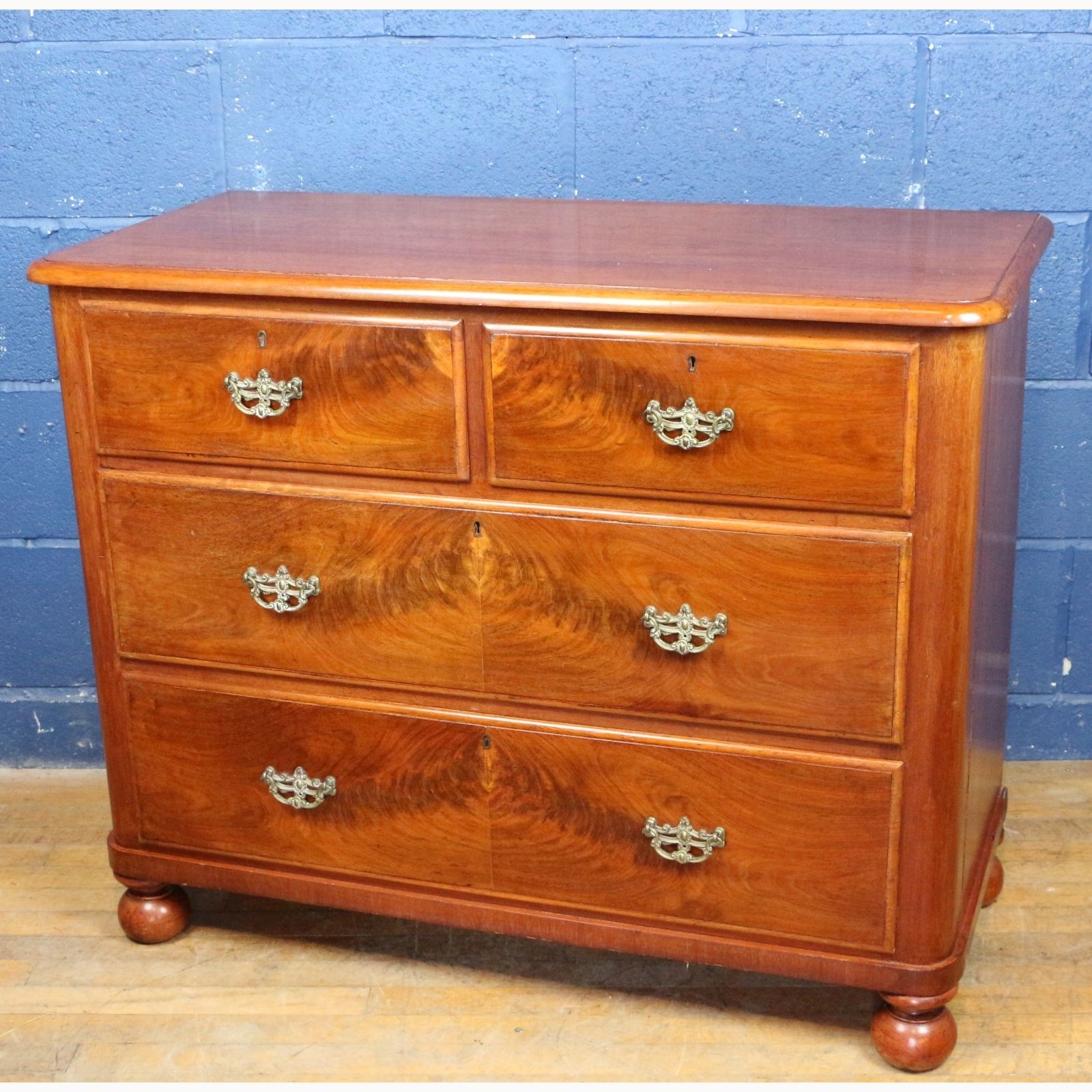 A Victorian Mahogany Two Over Two Chest Of Drawers Raised On Bun Feet photo furniture