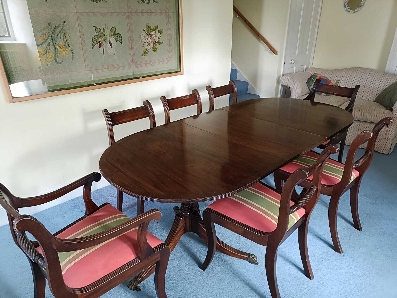 Regency Style Twin Pillar Dining Table With Removable Central Leaf.  Features Splayed Legs With Brass Castors Designed To Sit Up To 8 People.  Comes With 5 Chairs And 2 Carvers. photo for sale