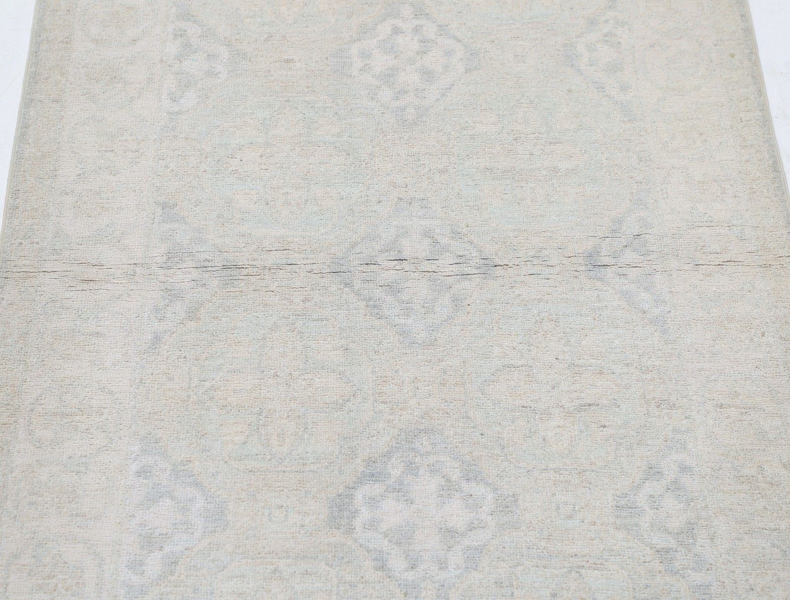 Tapis d'appoint traditionnel noué à la main, beige, 92 x 158 cm. Revêtement de sol en laine photo for sale