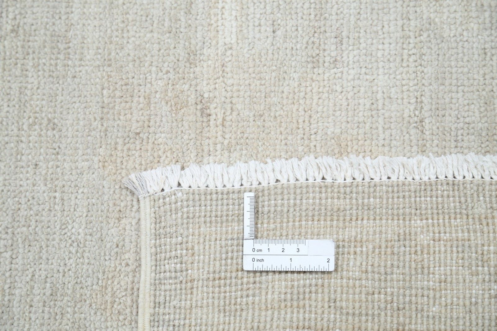 Beige wollen vloerkleed 270 x 366 cm. Handgeknoopt tapijt voor de woonkamer photo Textiel