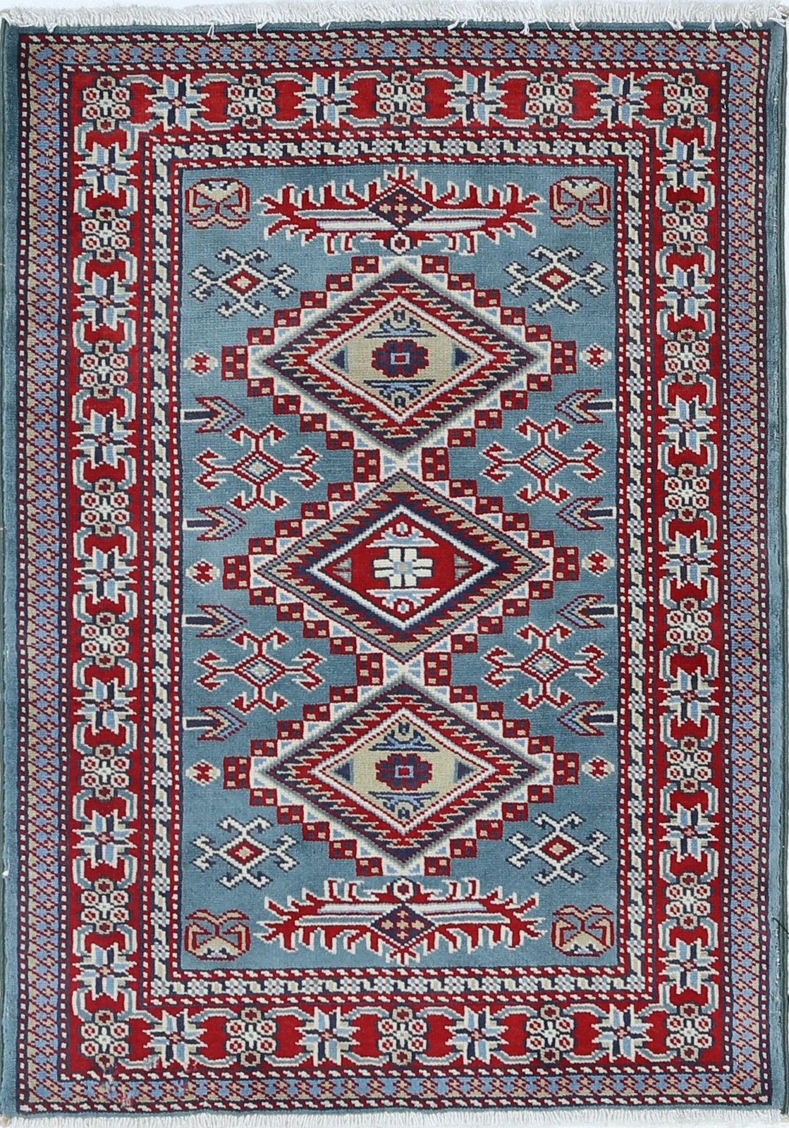 Tapis d'appoint noué à la main, bleu, rouge et ivoire, motif médaillon géométrique, 60 x 90 cm