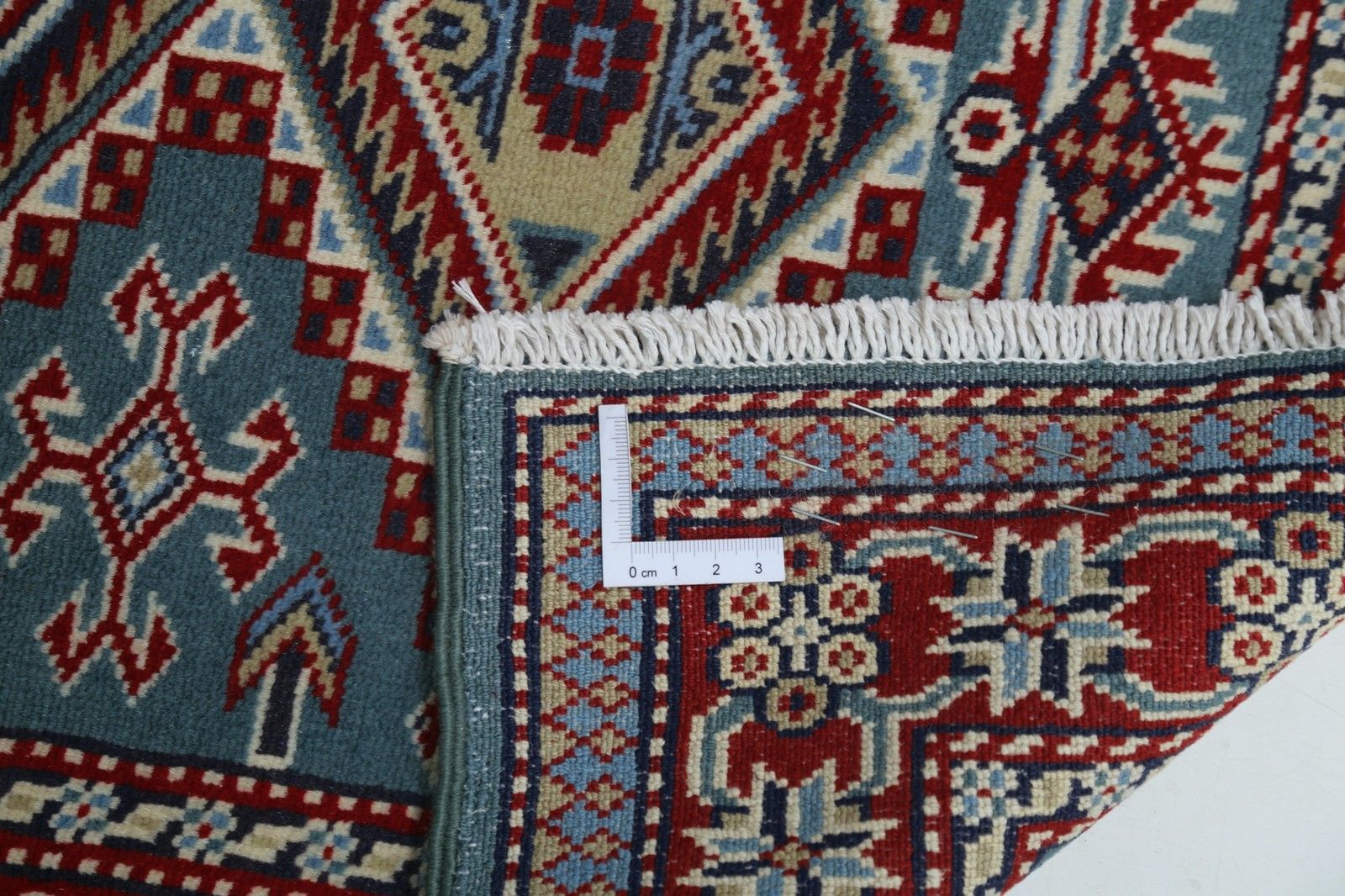 Tapis d'appoint noué à la main, bleu, rouge et ivoire, motif médaillon géométrique, 60 x 90 cm photo vinterior