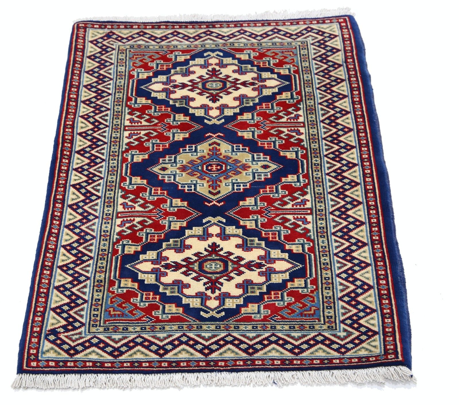 Tapis noué à la main 67 x 92 cm, bleu marine, rouge et ivoire. Motif médaillon géométrique photo Textiles