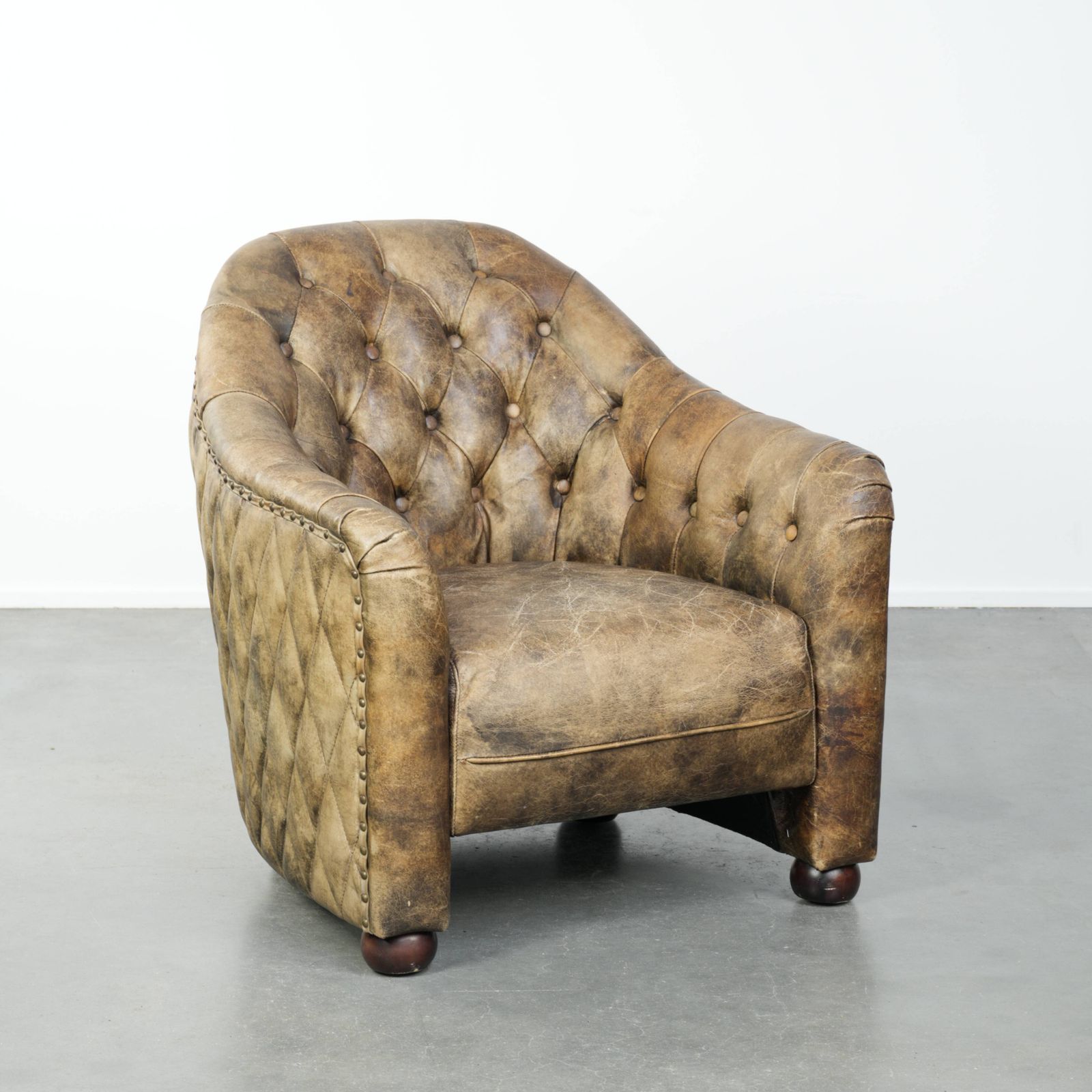 Unique, Stylish, And Comfortable Cowhide Chesterfield Club Armchair With A Beautiful Color Combination.