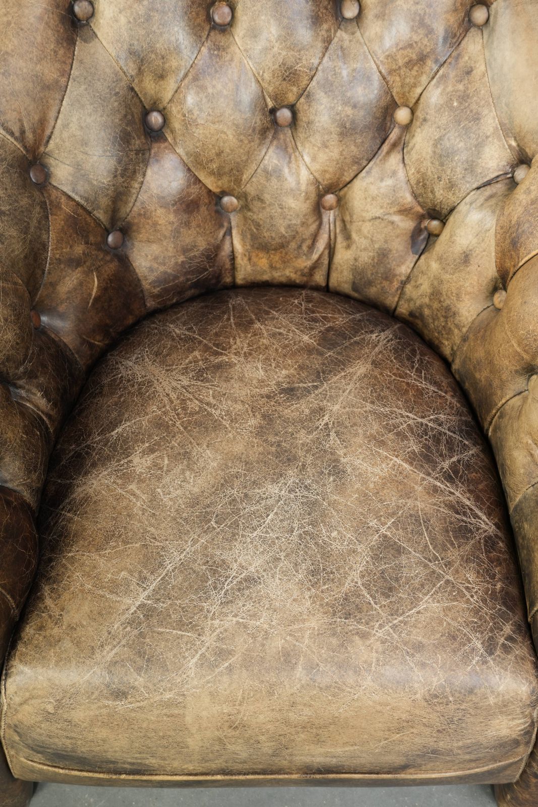 Unique, Stylish, And Comfortable Cowhide Chesterfield Club Armchair With A Beautiful Color Combination. photo vinterior