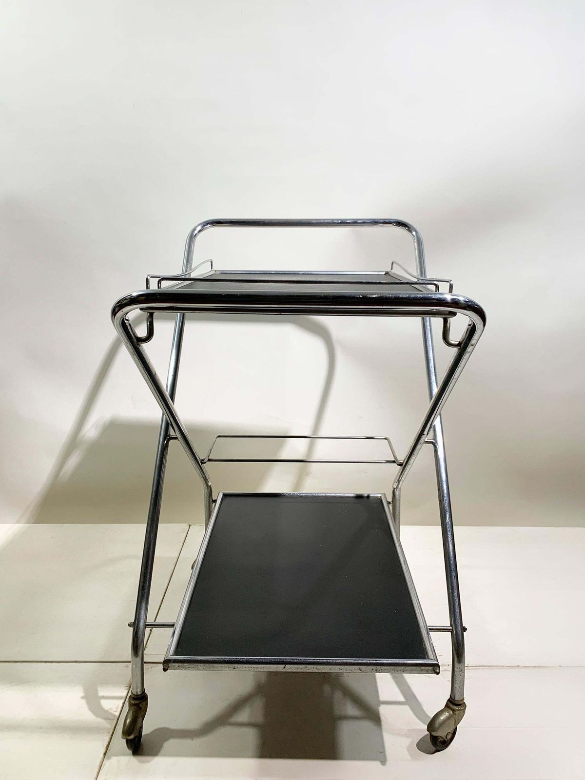 photo furniture Mid 20th Century Folding Bar Cart In Chrome And Black By Richard, Circa 1960's